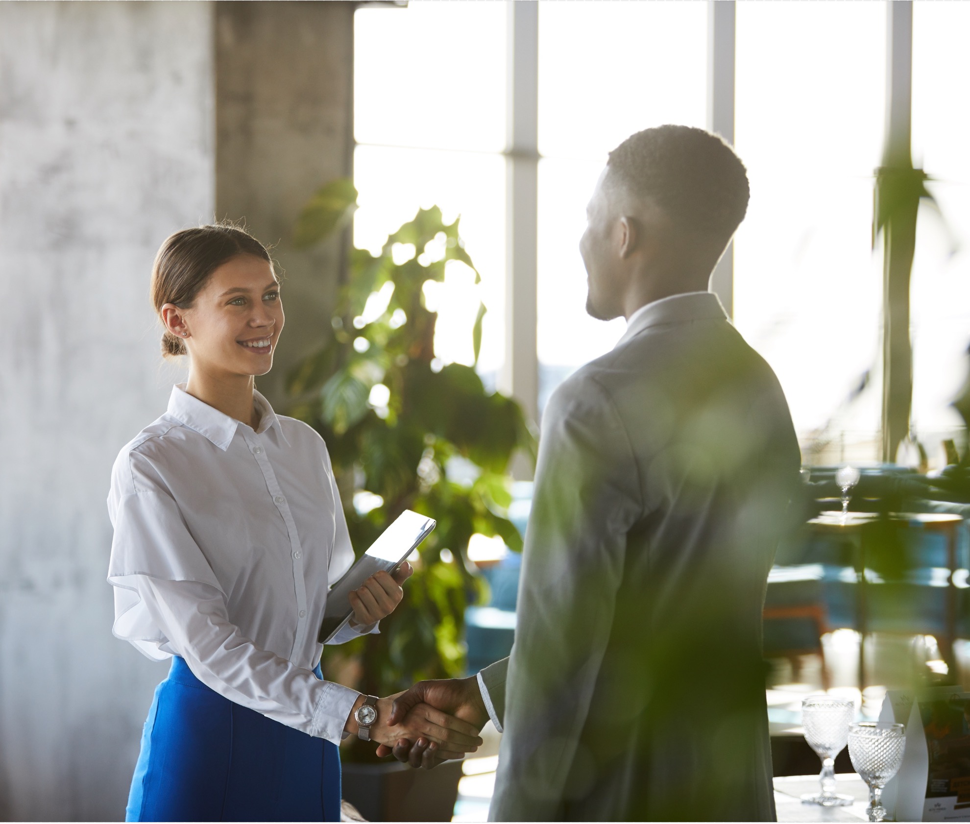 Two professionals shaking hands — RGMi referral and partner programs